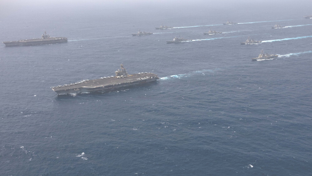 Iran continues to escalate, declaring Hormuz totally closed and targeting Bahrain, Jordan and two tankers associated with the United Arab Emirates early Tuesday alone. For the Islamic Republic, it’s worth the risk of busting the MOU and ceasefire to show the world who holds the cards over the all-important Strait of Hormuz. Photo: U.S. Navy warships transit the Arabian Sea in close formation as CENTCOM forces continue to promote regional security and stability, June 30, 2026. (U.S. Navy photo)