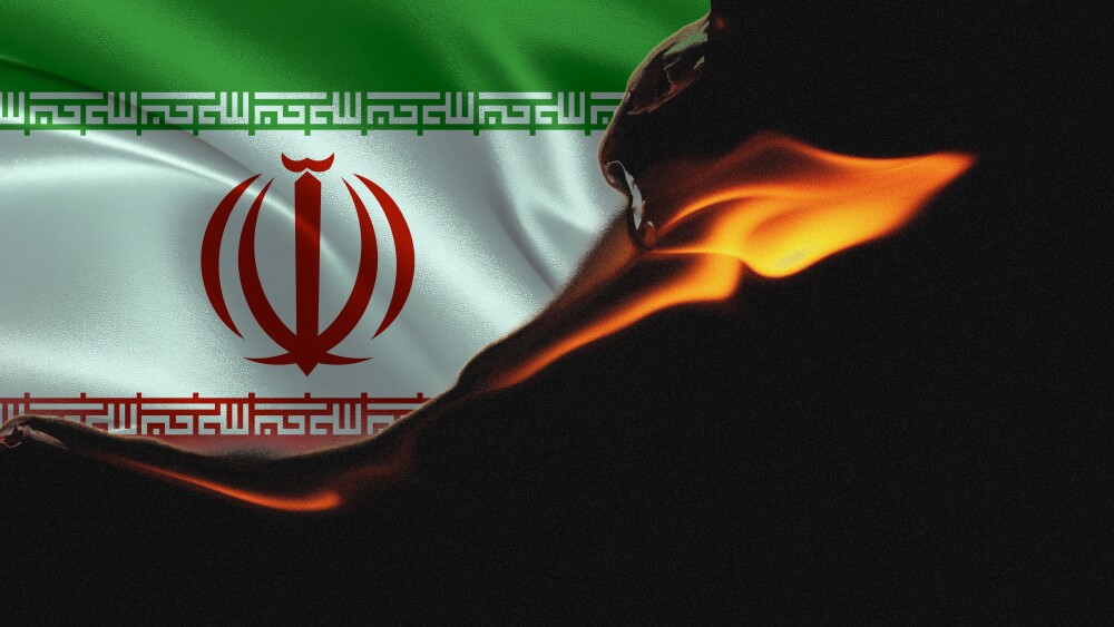 A flag of the Islamic Republic burns.