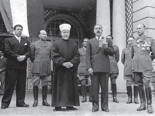 Pro-Nazi Iraqi broadcaster Yunis Bahri on the extreme left; Grand Mufti of Jerusalem Hajj Amin El Husseini in clerical garb; Rashid Ali al-Kilani (speaking), former prime minister of Iraq, who organized a failed rebellion against the British; and the Iraqi general Ibrahim Pasha al-Rawi. Berlin, May 2, 1943.