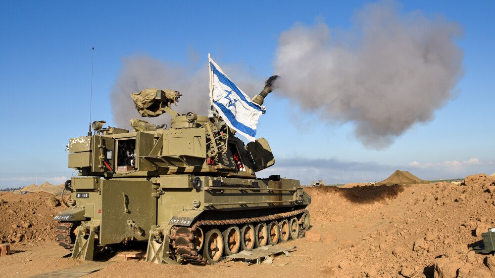 An IDF M109 howitzer artillery cannon fires 155mm shells at the Gaza Strip to attack Hamas targets. Gaza Envelope, Israel, October 25, 2023.