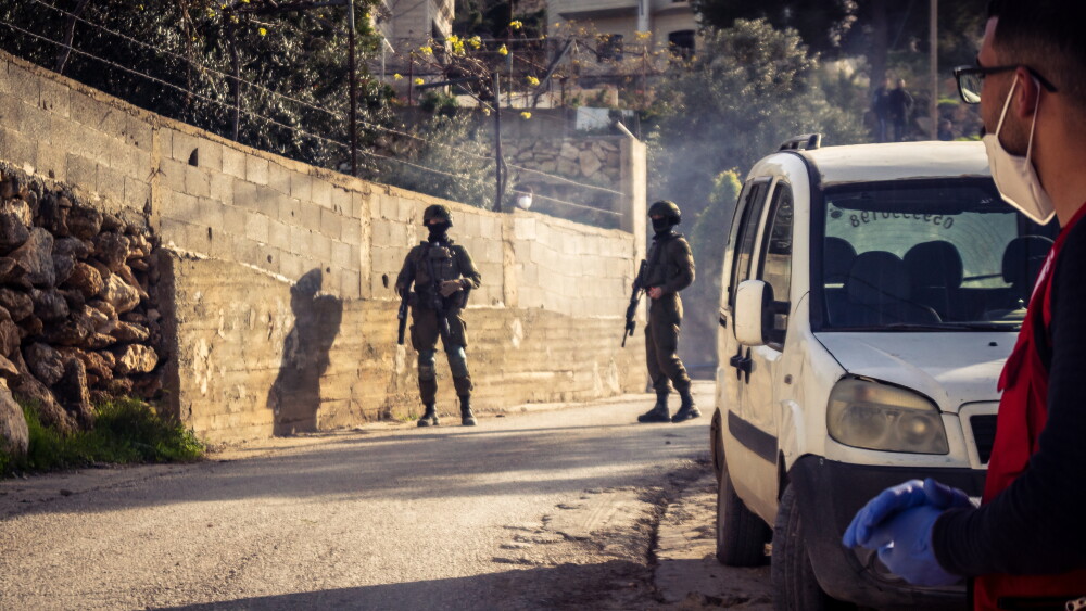 Israeli soldiers oversee the demolition of a Palestinian home in Tarqumiyah, West Bank, in February 2026.