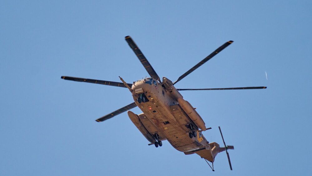 At Ichilov Hospital, an IDF helicopter lands on the tower helipad as released hostages arrive for medical checks and reunions after more than two years in captivity; Tel Aviv, October 13, 2025.