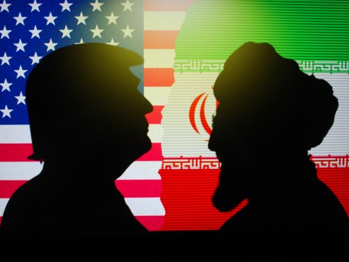 Silhouettes of President Donald Trump and Iran's Supreme Leader Ali Khamenei.