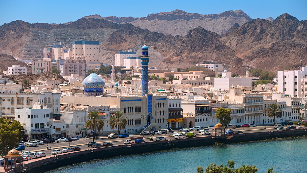 A panoramic view of the waterfront commercial center in Muscat, Oman.