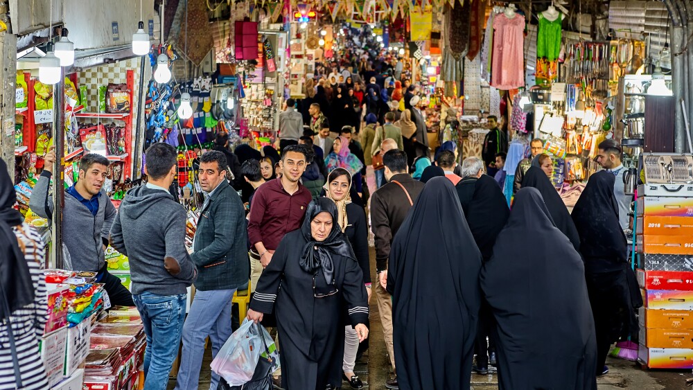 People mingle in a bazaar in Tehran, Iran.
