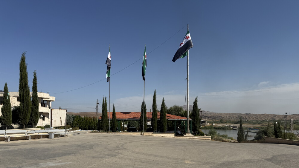 Newly installed Syrian flags at the Semalka border crossing between Syria and Iraqi Kurdistan, October 20, 2026.