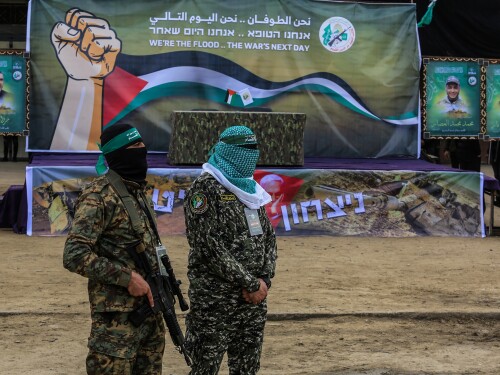 CAGE, an advocacy group with a track record of supporting Muslim terrorism suspects, is invoking European human rights legislation to contest the U.K. government’s designation of Hamas as a terrorist organization. Above Hamas fighters stand watch during the handover of hostages taken on October 7, 2023, to the Red Cross in Deir al-Balah, central Gaza Strip, on February 8, 2025.