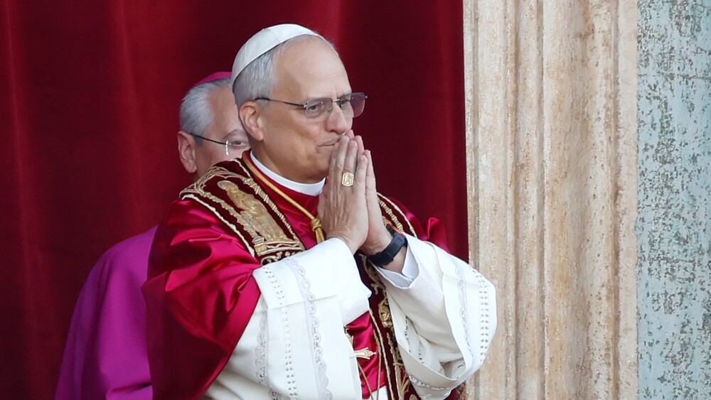 Pope Leo XIV appears at the central loggia of St. Peter’s Basilica in Vatican City in May 2025.