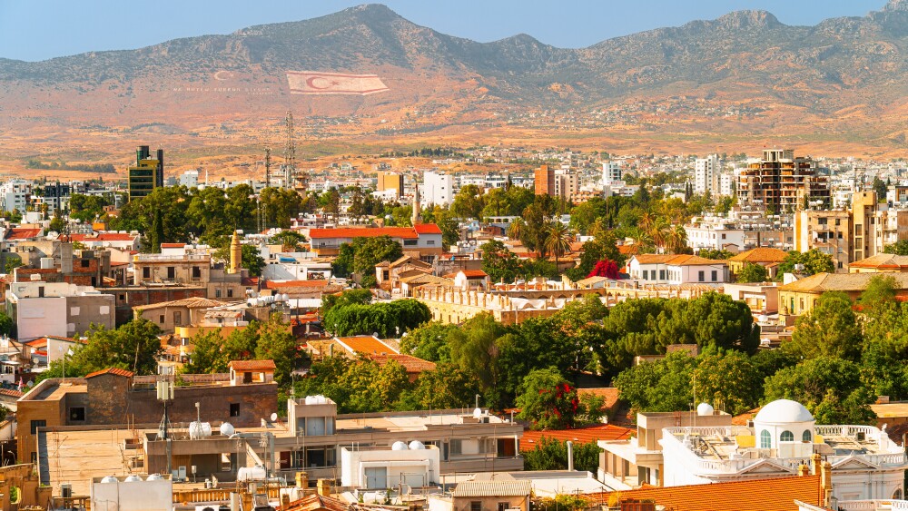 A Turkish flag is visible on a mountain behind Nicosia, in the occupied part of northern Cyprus.