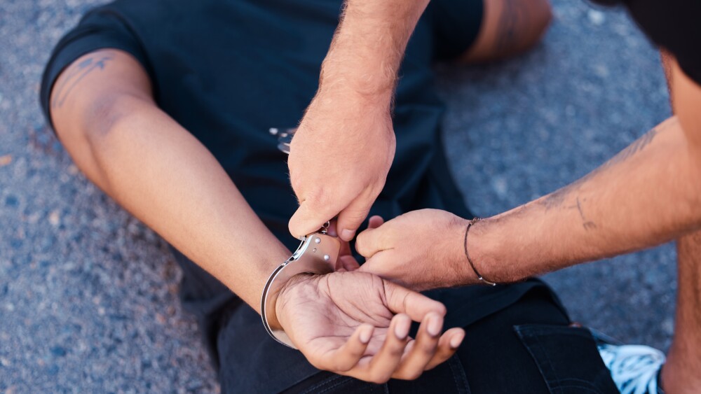 A man is handcuffed in this file photo.