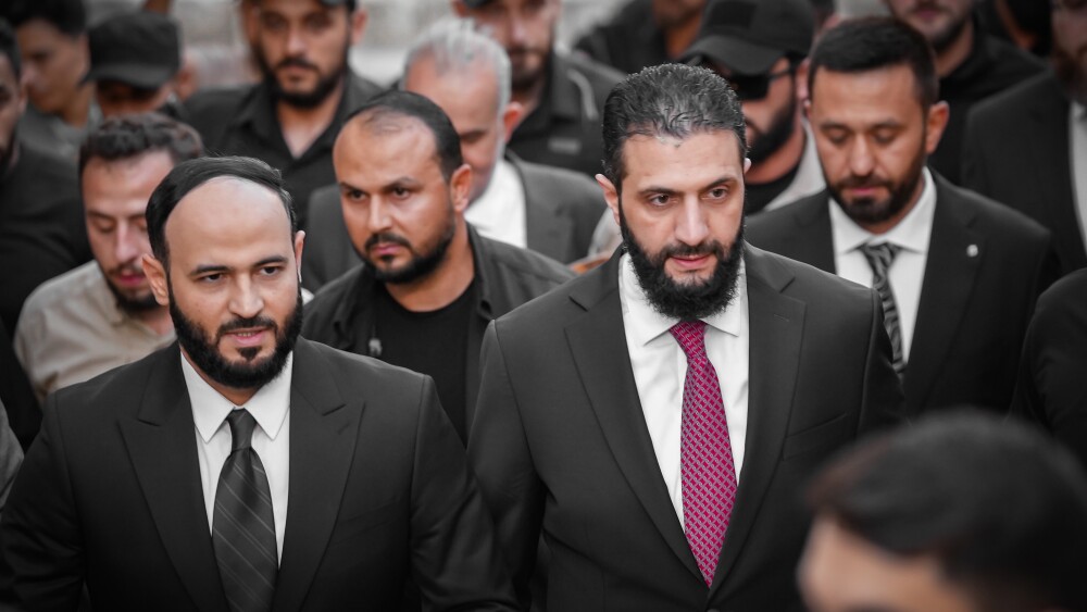 Syrian President Ahmed al-Sharaa (center right) in May 2025.