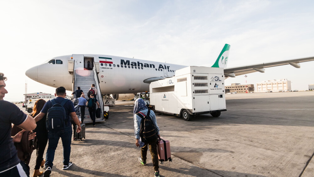 Passengers board a flight from Tehran on Mahan Air, which is largely under the control of the Islamic Revolutionary Guard Corps and its Qods Force.