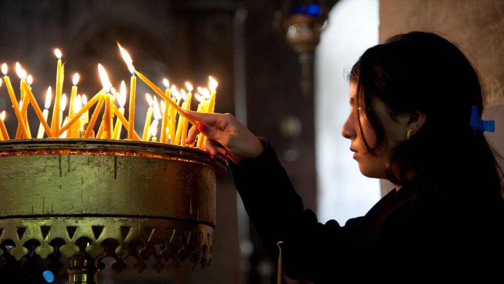 Israel’s global standing depends on its relations with the Christian world. The vast majority of the Zionists in the world are Christian. A girl lights a prayer candle in the Church of the Nativity, traditional site of the birth of Jesus, Bethlehem, West Bank.
