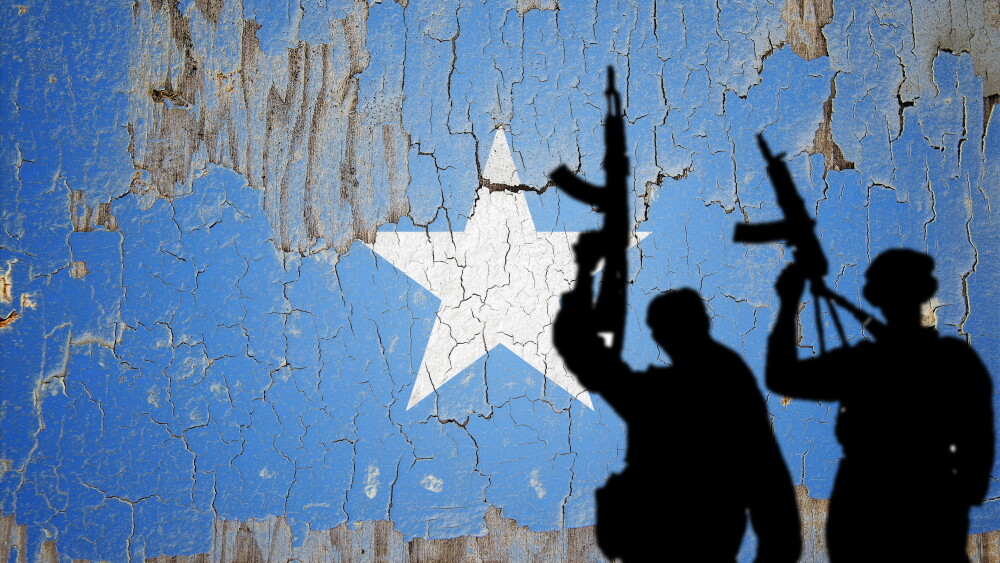 The flag of Somalia on a cracked wall.