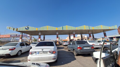 Iranians lining up at a gas station to refuel after Israel's June 12 attacks led to gasoline rationing and shortages; Tehran, June 15, 2025.