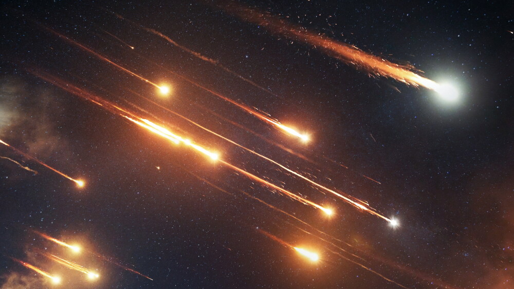 Ballistic missiles soar into the night sky.