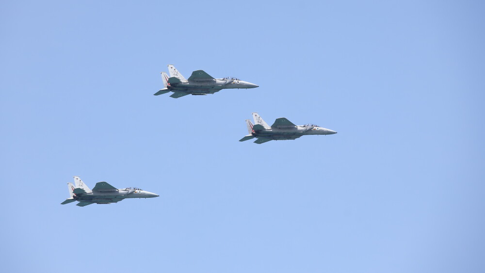 Israeli Air Force F-15 fighters fly in formation over the Mediterranean Sea as seen from a Tel Aviv beach during an Air Show dedicated to Israel's Independence Day; April 15, 2021.