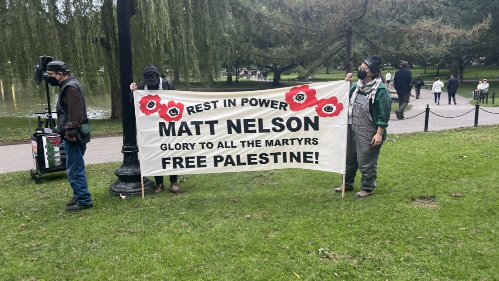 Pro-Hamas activists display a banner lionizing Matt Nelson, a radical leftist who immolated himself in front of the Israeli Consulate in Boston on September 11, 2024. Masked activists displayed the banner during a September 2024 vigil organized by the Muslim Justice League, a Boston-based nonprofit that received $100,000 from the Lenny Zakim Fund, which has subsequently rebuked the organization for its radicalism.