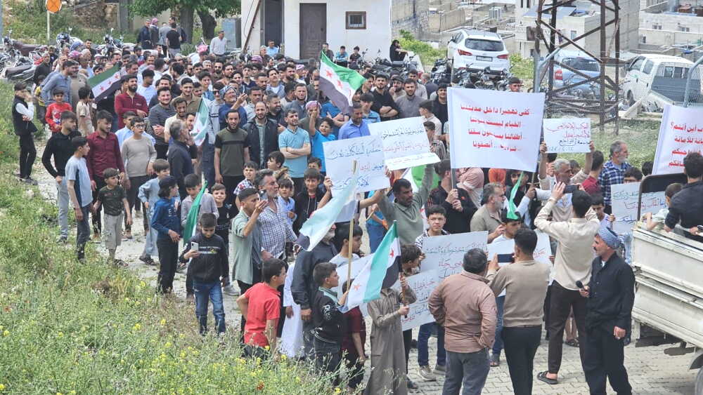 People from Jabal Aqil, Syria, protest against the establishment of a Turkish military base that forced them to evacuate their homes.