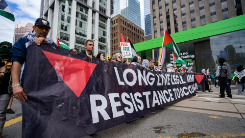 People protest at a Palestinian rally against the war in Gaza. Toronto, Canada - May 25, 2024.
