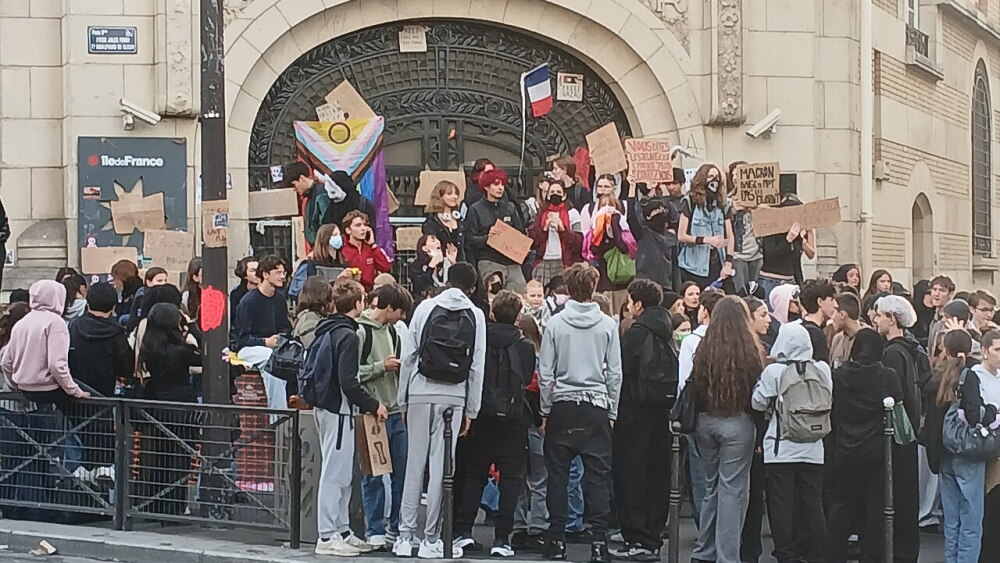 Students blockade a Paris high school on October 2, 2026, during the nationwide student protests that began September 28. In Beaugency and several other towns, students taking part in the movement were filmed chanting a rap song glorifying jihadist killers Mohamed Merah and Salah Abdeslam, which led Orléans prosecutors to open an investigation for "apology for terrorism." The chants legitimize concerns about Islamist efforts to transform youth culture in France.
