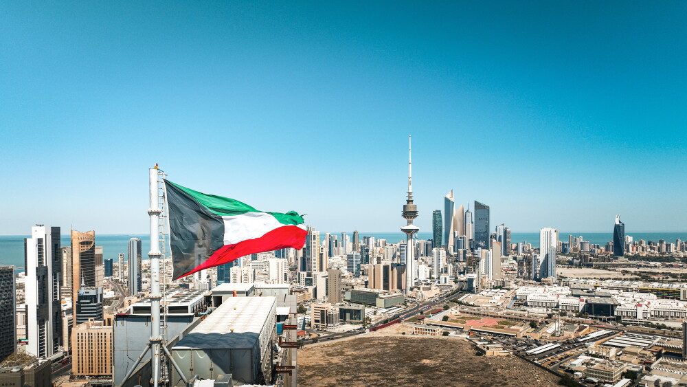 The flag of Kuwait flies above Kuwait City.