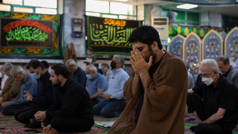 A Muslim man prays in Tajrish, Iran, in 2023.