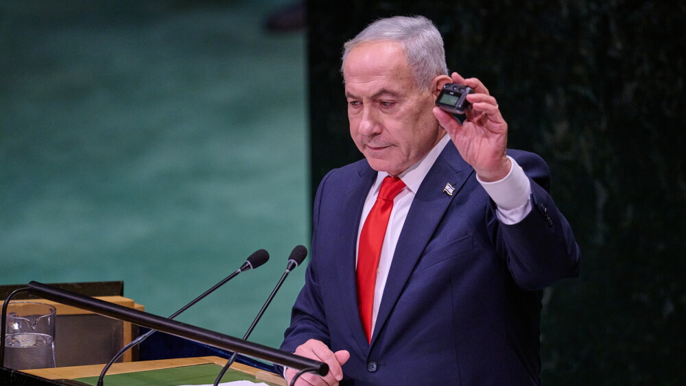 Prime Minister Benjamin Netanyahu held up a pager as he reminded his listeners at the United Nations General Assembly in New York of Israel’s September 2024 attack on Hezbollah; September 22, 2026.